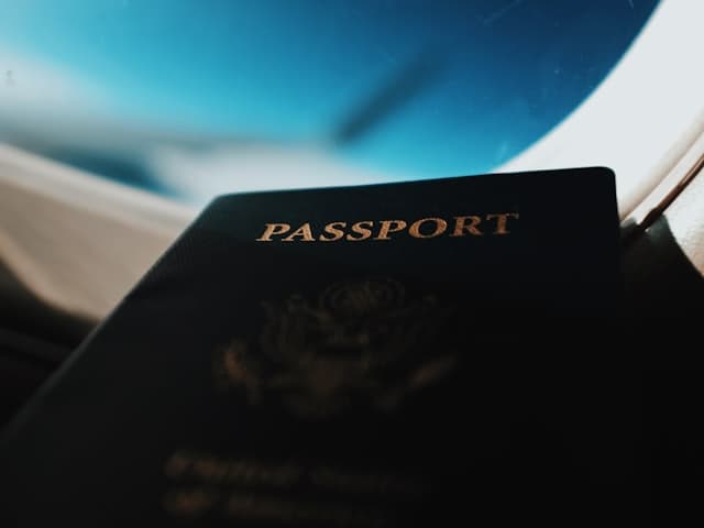 Passport by an airplane window